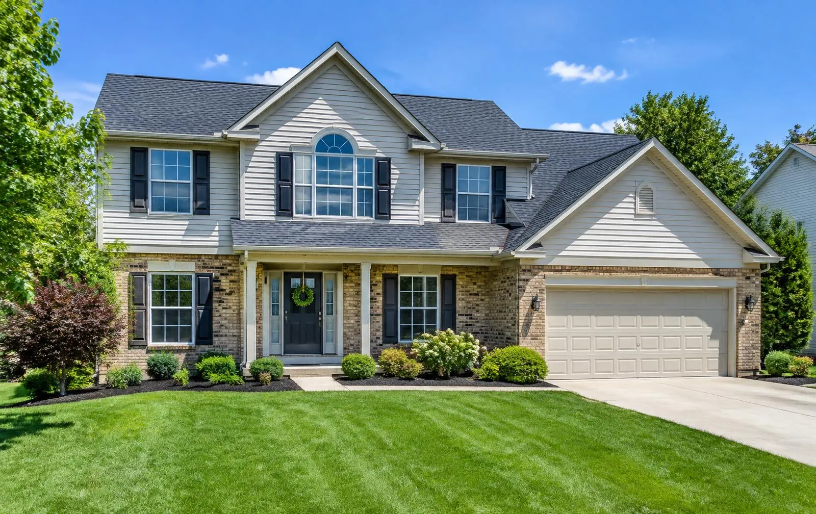 Two-story Butler County home with a new charcoal architectural shingle roof